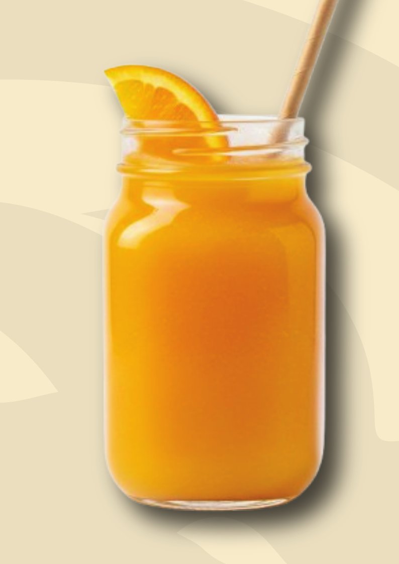Fresh orange juice in a mason jar with an orange slice