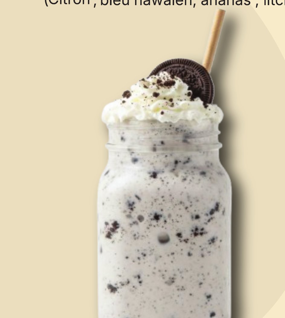 Oreo milkshake topped with whipped cream and an Oreo cookie